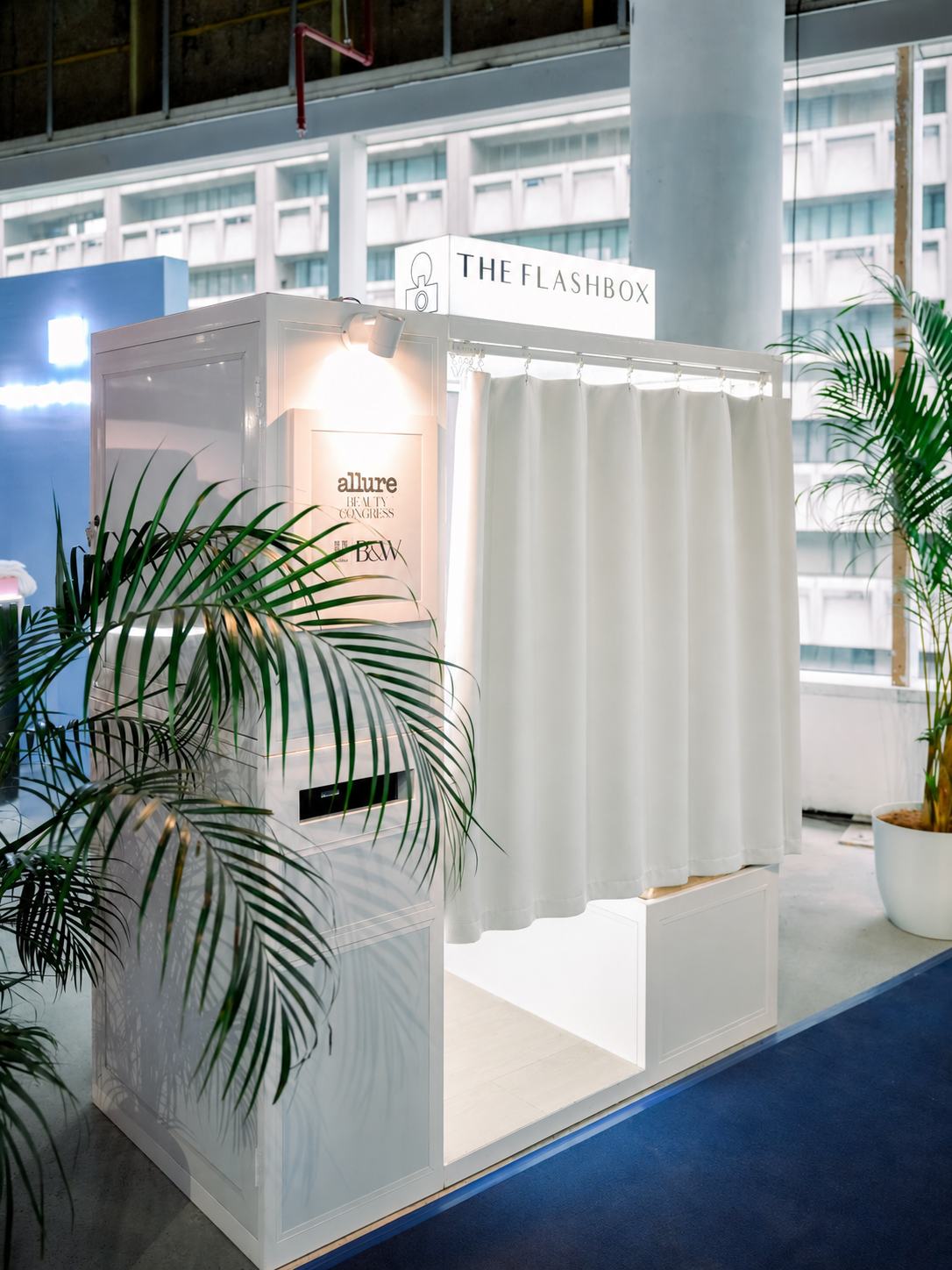The white Flashbox booth at the Allure Beauty Congress